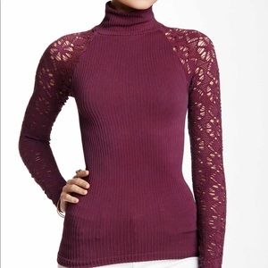 New Free People top with lace arms. Form fitting.